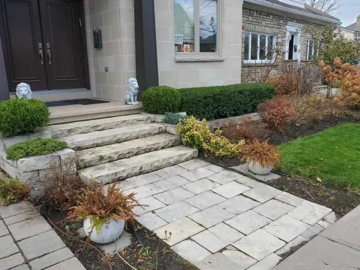 The same front entry after restoration with tidy beds