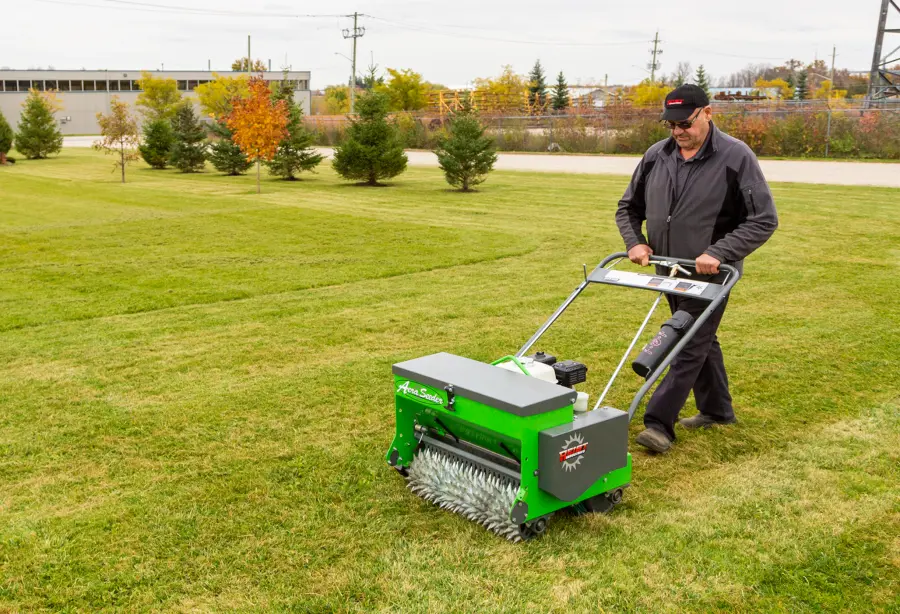The 24-inch Aeraseeder being demonstrated on an open lawn