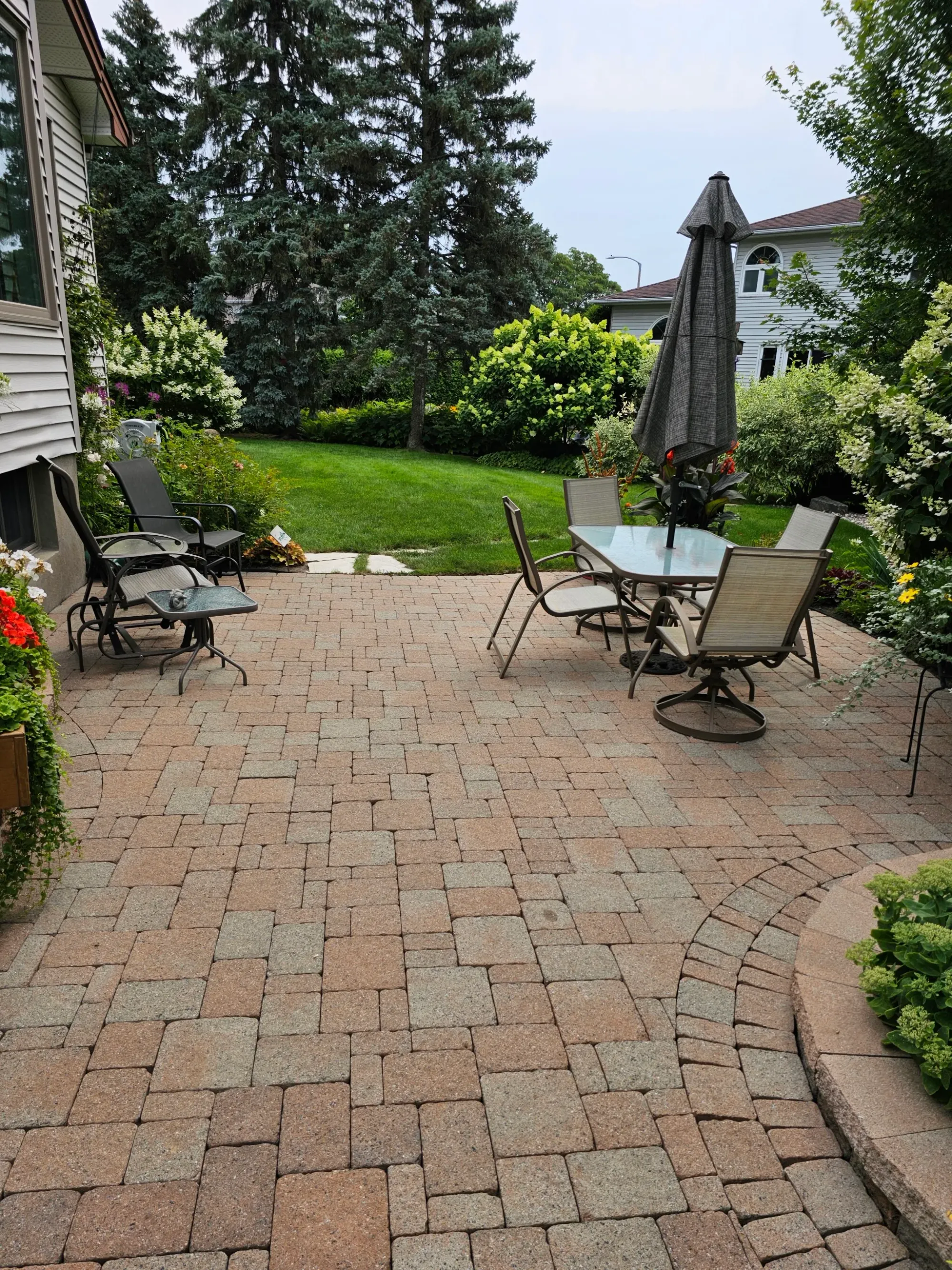 The same patio cleaned — joints cleared out and colour revived, ready for new sand